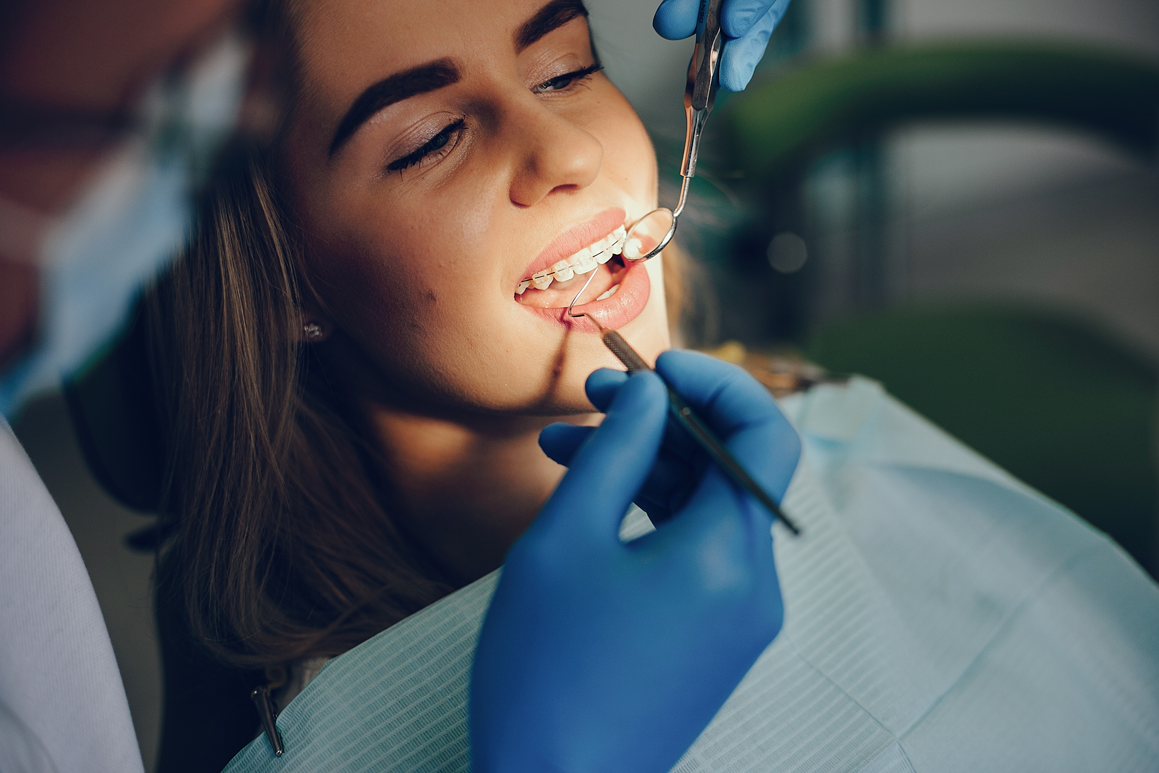 beautiful girl sitting in the dentist's office